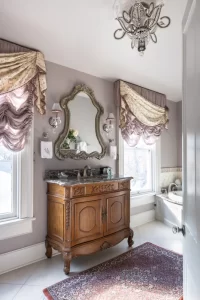 Large lavender and white tile bathroom with elegant vanity