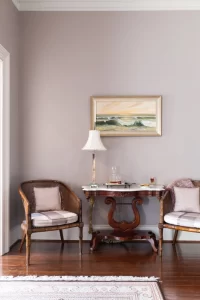 Seating area in bedroom with brandy and cookies