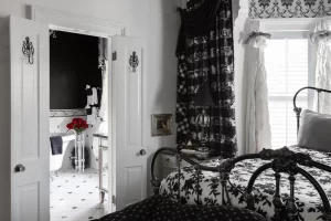 View from The Sawyer Scott bedroom into the black and white tiled bathroom