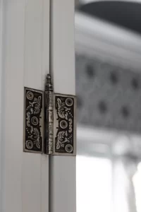 Vintage-inspired decorative door hinge closeup
