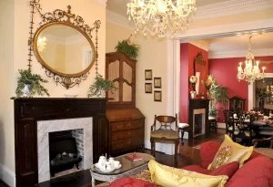 Parlor / Lounge at 1890 Caroline House with view of decorative fireplace