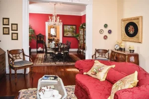 Parlor / Lounge at 1890 Caroline House with Formal Dining Room in background