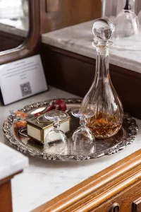 Brandy decanter closeup in Canopy bedroom