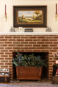 Isabella's Suite living room with decorative brick fireplace