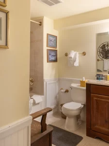 Kitchen House bathroom with tile floor and tile shower / tub