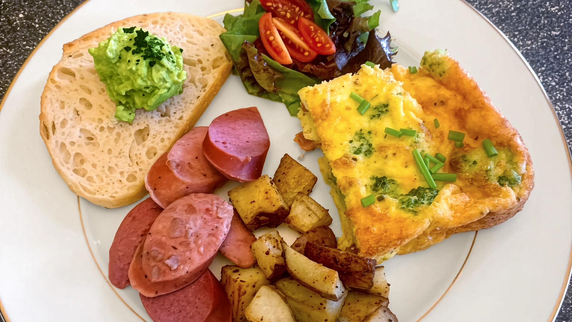 Egg bake, fried potatoes, kielbasa, and avocado toast - putting the breakfast in bed and breakfast
