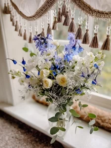 Beautiful blue, white, and yellow bouquet from a special event at The Richard Johnston Inn