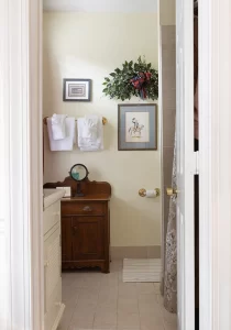 The Virginian light cream colored bathroom with tile floor.
